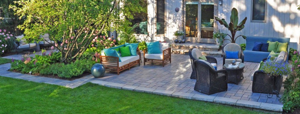 rock-patio with outdoor furniture | OCI Landscaping and Irrigation